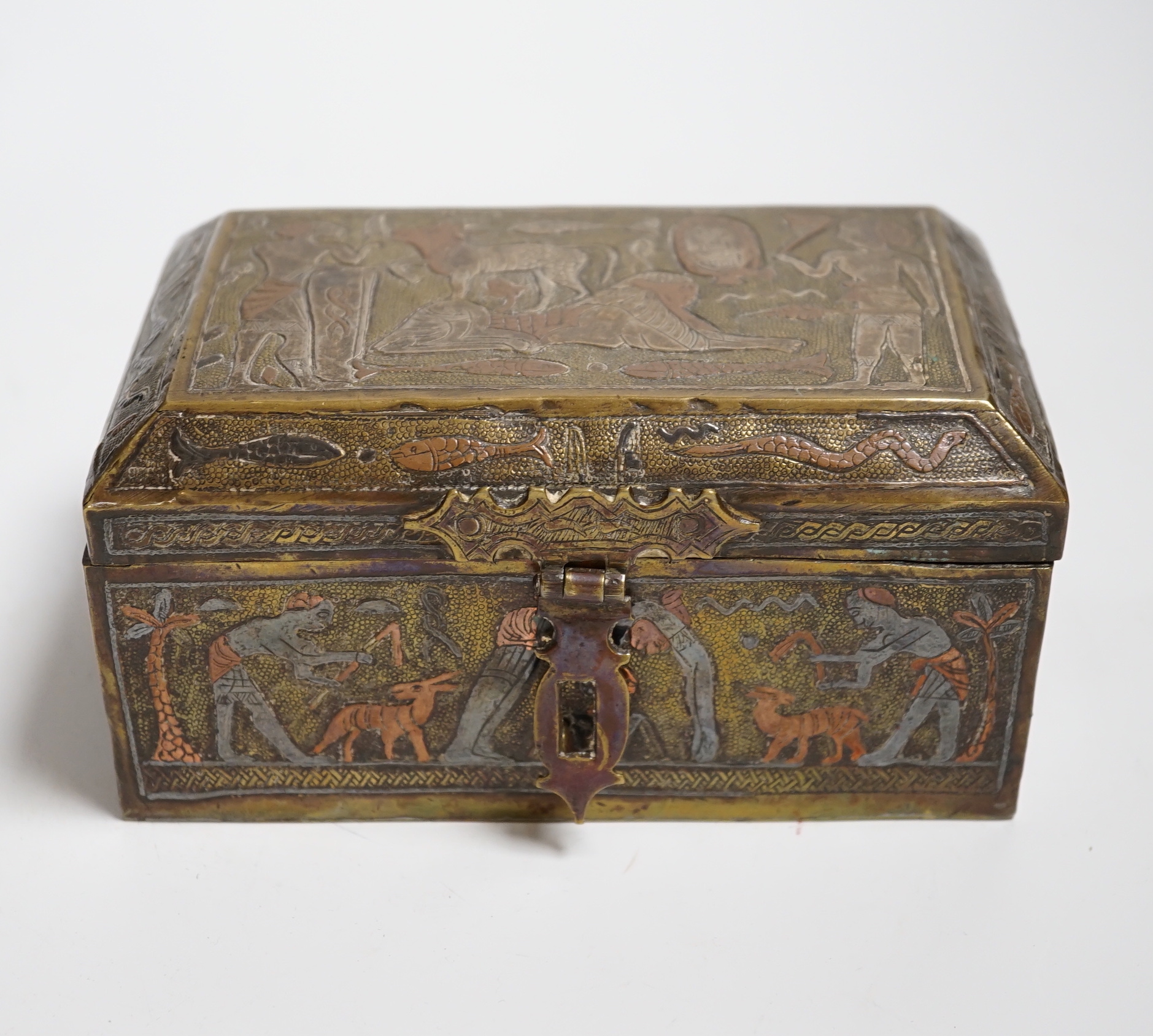 A Cairo ware box, decorated with ancient Egyptian figures, 15.5 cm wide